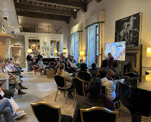 Students listening to presentation in Italian villa
