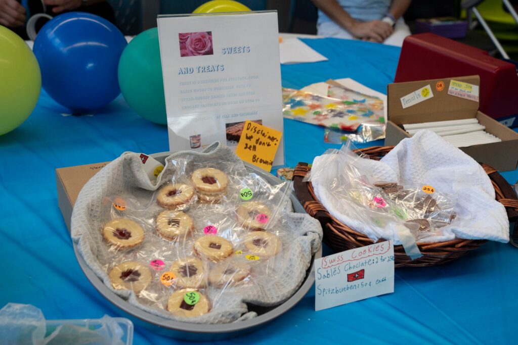 Photo of two baskets of cookies. “Sweets and Treats” was one of the many venture stands at the Founders Festival inside Stone-Robinson’s library. (Photo by Dan Addison, University Communications)