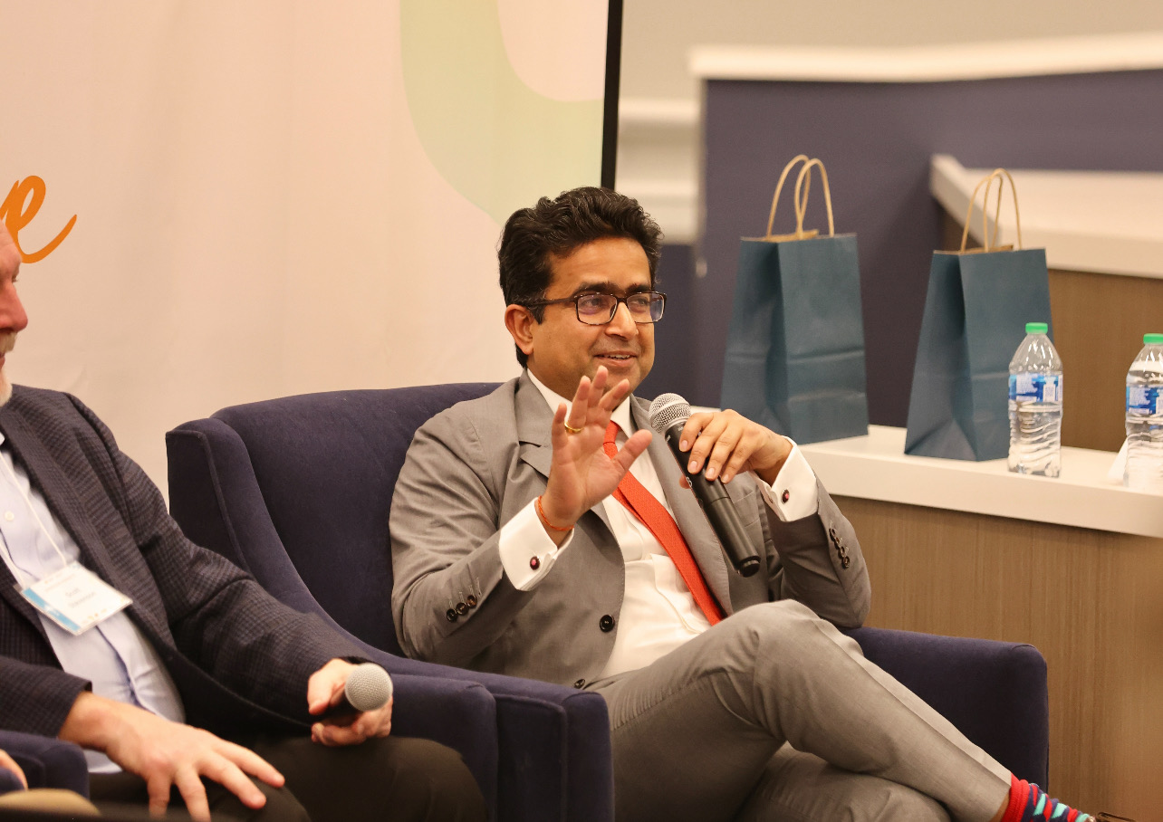 Photo of Manoj Sinha (MBA '09) speaking on a panel at Darden.