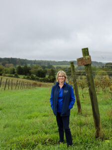 Dorothy Batten stands in the vineyard at Oakencroft Farm & Winery.