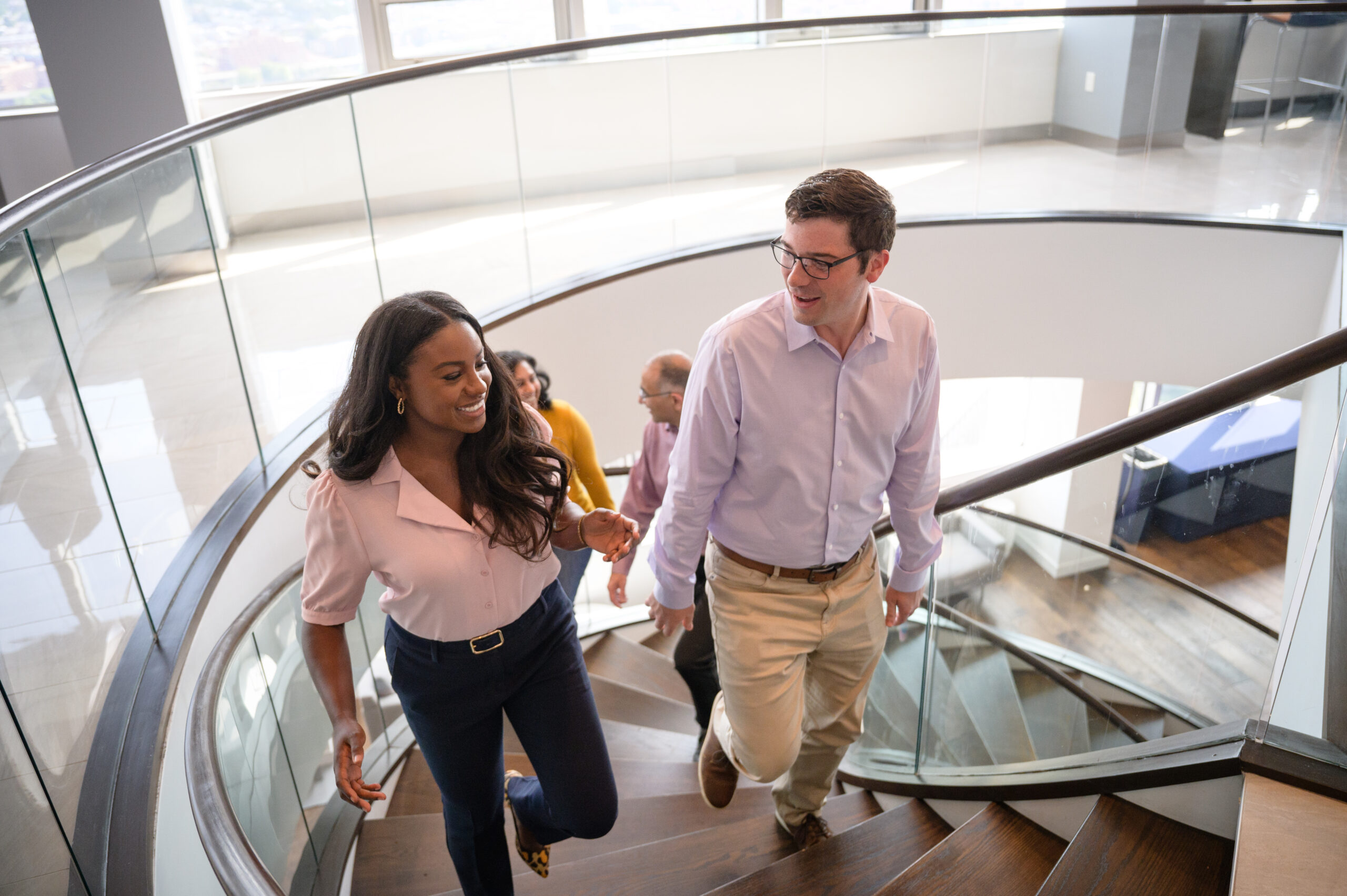 Darden students climb up the stairs at Darden Grounds in the DC Metro Area.