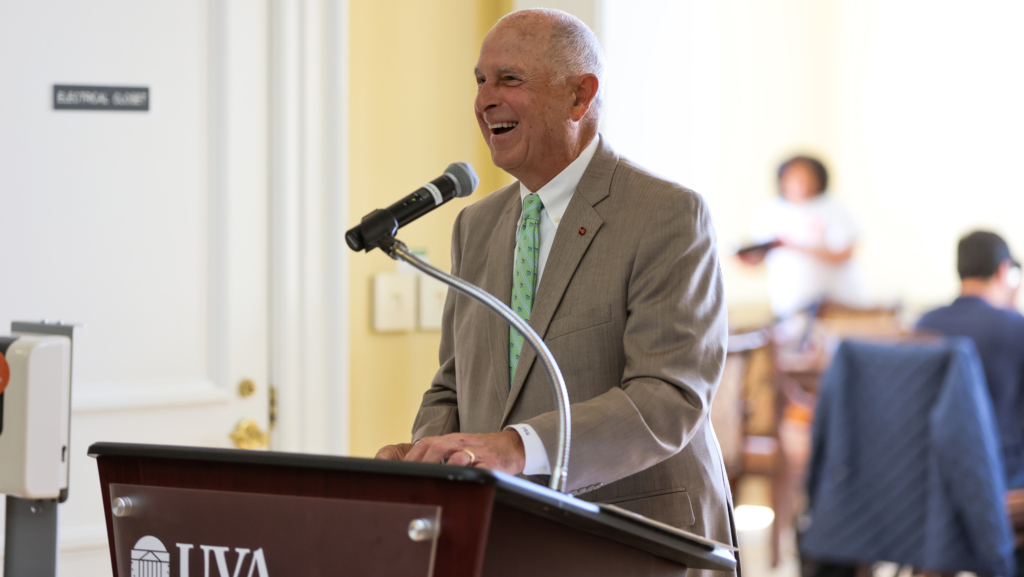 Frank Genovese smiles as he delivers remarks from the podium during the 2025 Genovese Fellowship announcement at Darden.